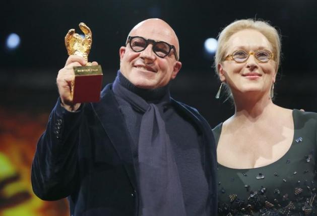 Director Gianfranco Rosi poses with Jury President Streep after receiving Golden Bear during awards ceremony at 66th Berlinale International Film Festival in Berlin